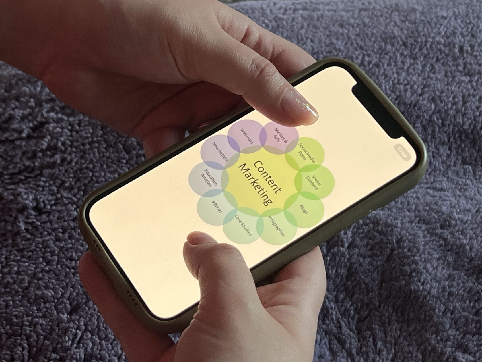 hands holding phone with content marketing info 